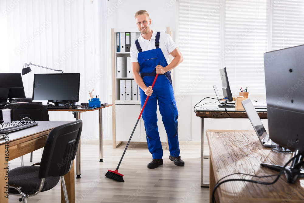 Male Janitor Cleaning Floor With Broom Stock-Foto | Adobe Stock