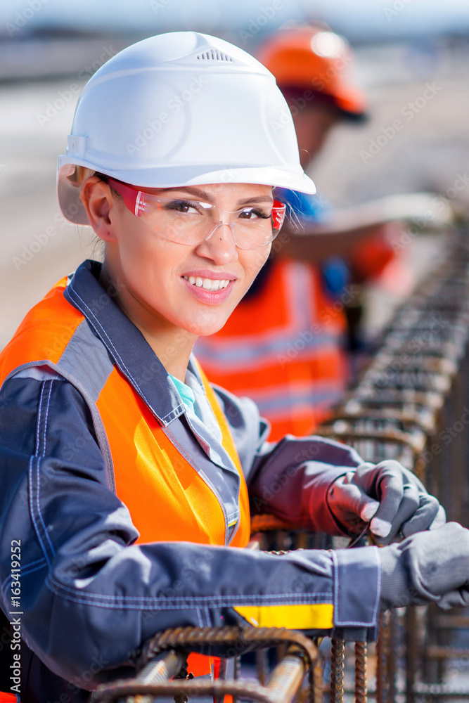 worker fixing steel rebar at building site worker fixing steel rebar at building site