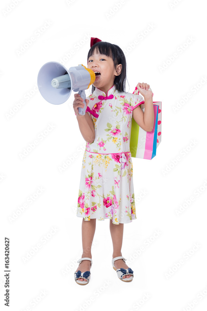 Asian Chinese little girl holding shopping bags and loudspeaker Asian Chinese little girl holding shopping bags and loudspeaker
