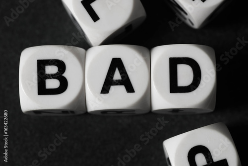word bad on toy cubes