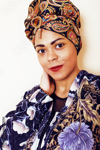 beauty bright african woman with creative make up, shawl on head like cubian closeup smiling, cheerful tan   lifestyle people concept photo