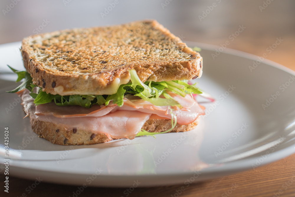 multigrain toasted sandwich with ham cheese tomato and lettuce multigrain toasted sandwich with ham cheese tomato and lettuce