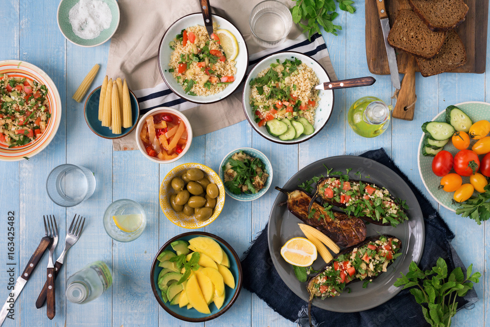 Set of healthy vegetarian food on a wooden table