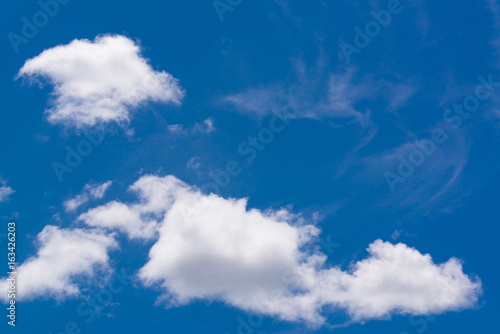 Deep blue sky and clouds.