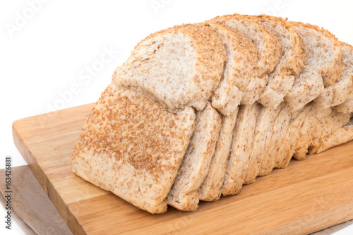 whole grain bread on wood board
