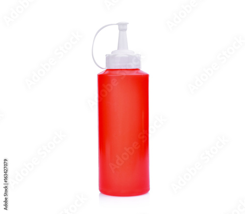 red plastic sauce bottle isolated on white background