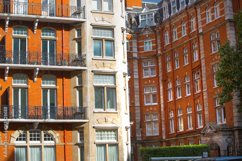 Windows of the luxury apartments in Kensington. Centre London residential buildings. Kensington church street.