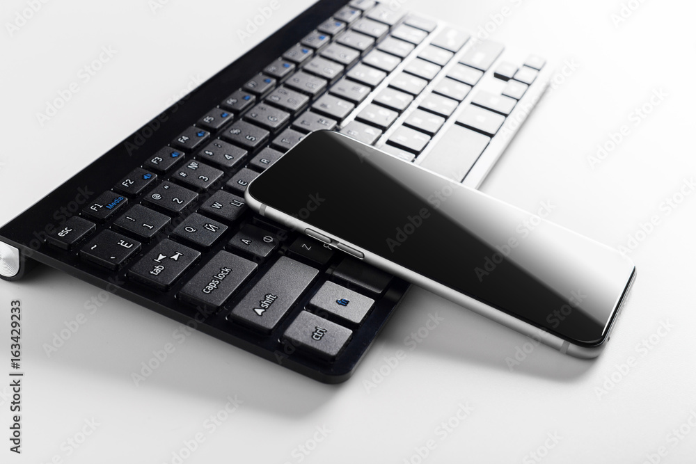 keyboard with mobile phone on the table keyboard with mobile phone on the table