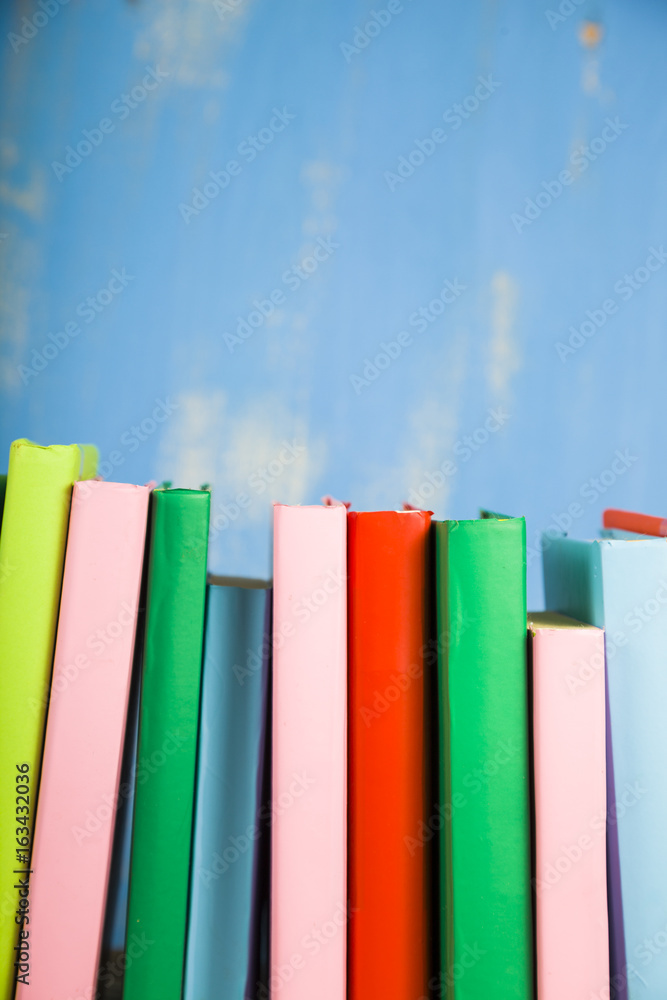 Stack of books on a blue background. Stack of books on a blue background.