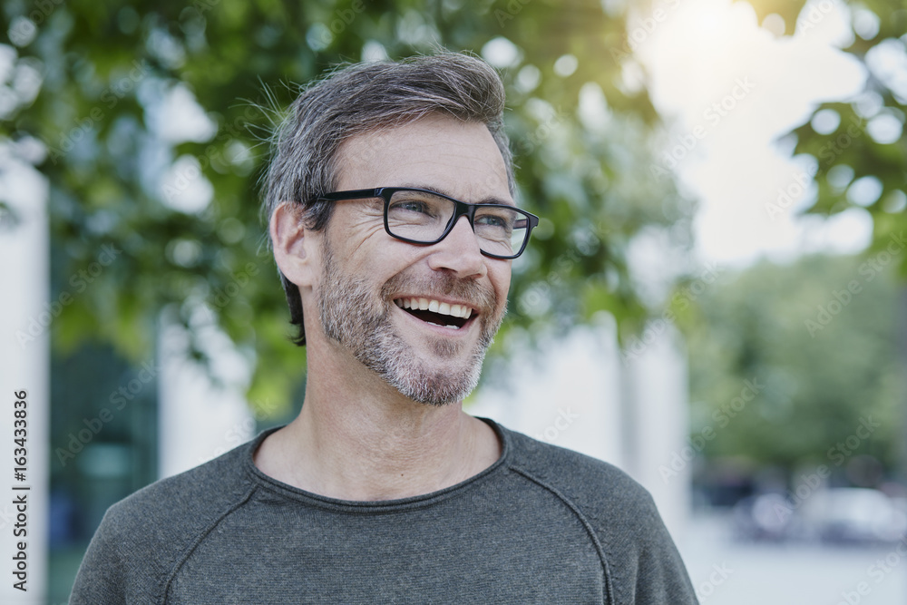 Laughing mature man outdoors Laughing mature man outdoors