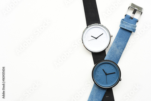Black and blue wristwatches isolated on white background