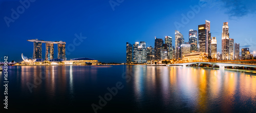 Panoramic photograph of Singapore skyline at night. Central Business District, Fullerton Park at the newly built Jubilee Bridge.