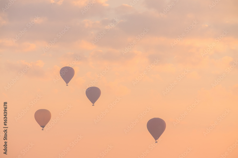 Fototapeta premium Hot Air Balloon with Dramatic Sky in Morning