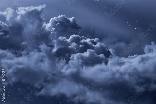Cloudy night sky with stars