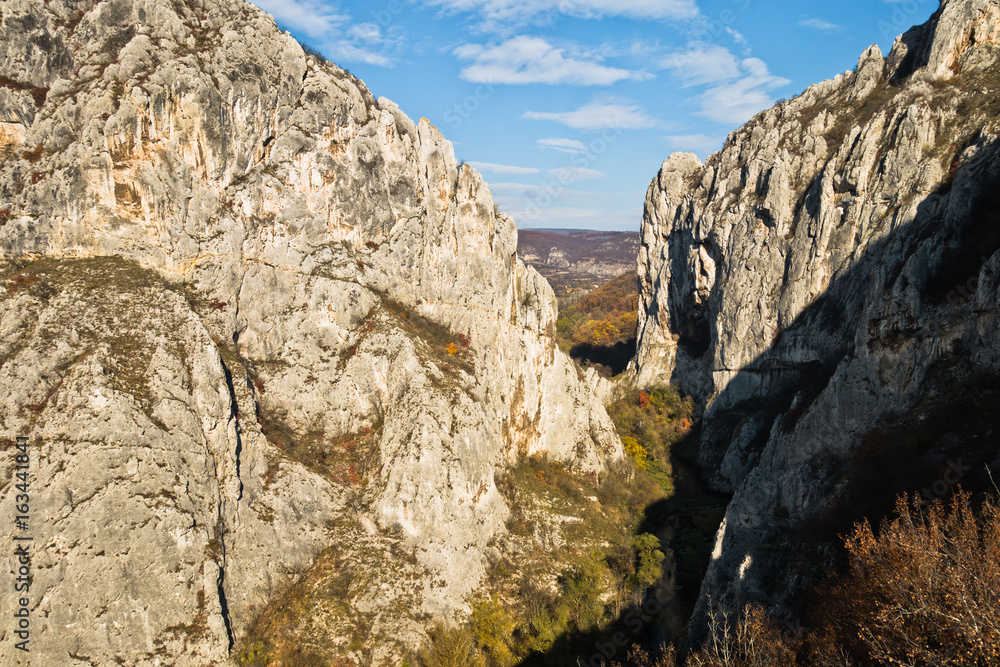 Play of light and shadows at sunset on rocks of Nisevacka gorge in east Serbia