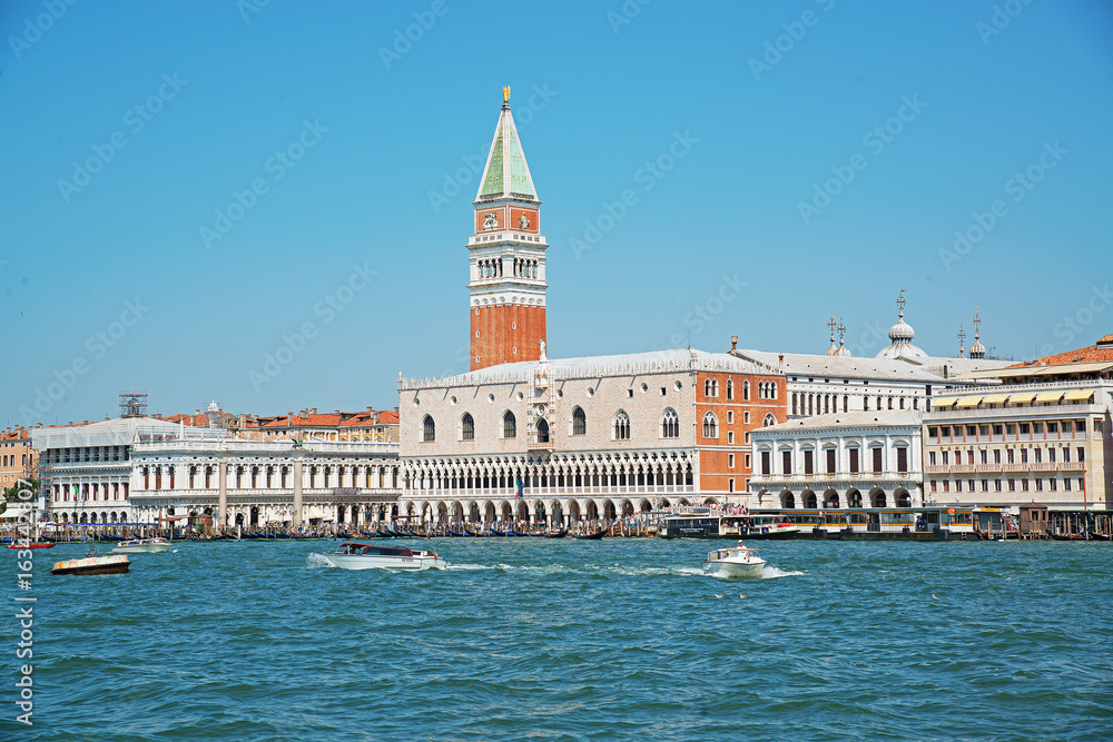 ITALY. VENICE - June 20, 2017: pleasure boats floating on the background of the bell tower of St. Mark's Cathedral and the Palazzo Ducale.