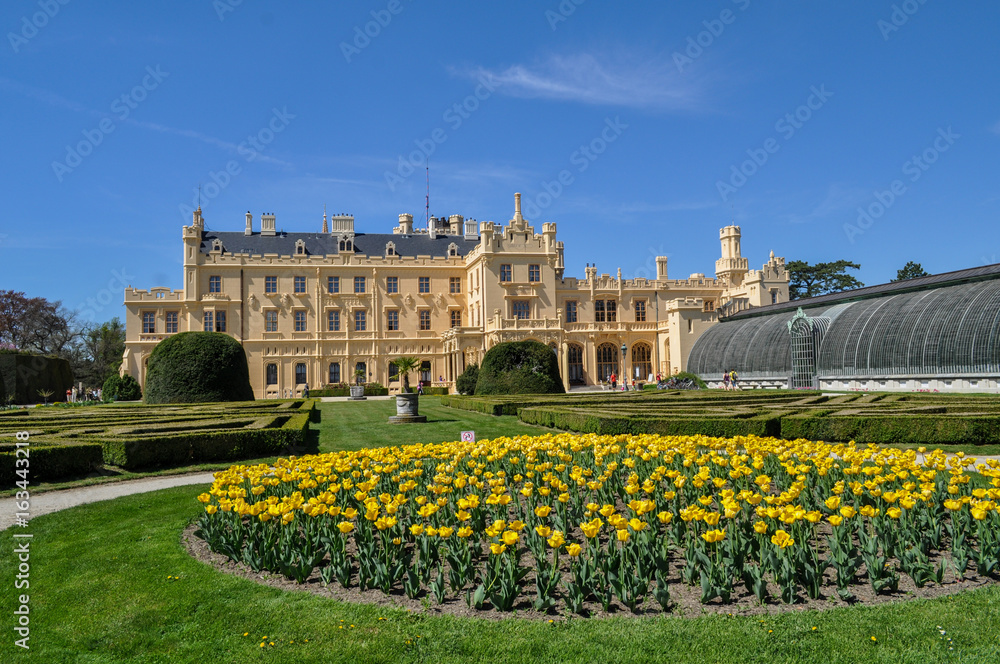 Chateau Lednice, Czech Republic. A beautiful castle with a garden and yellow flowers