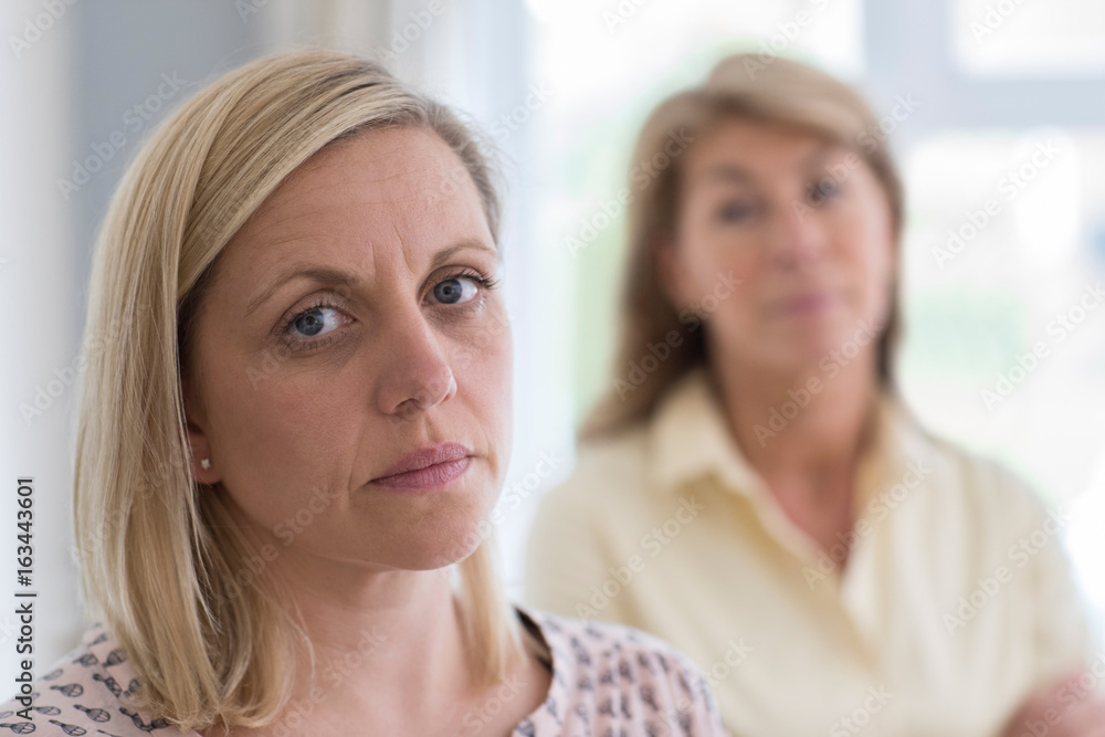 Mature Mother Concerned About Adult Daughter At Home Mature Mother Concerned About Adult Daughter At Home