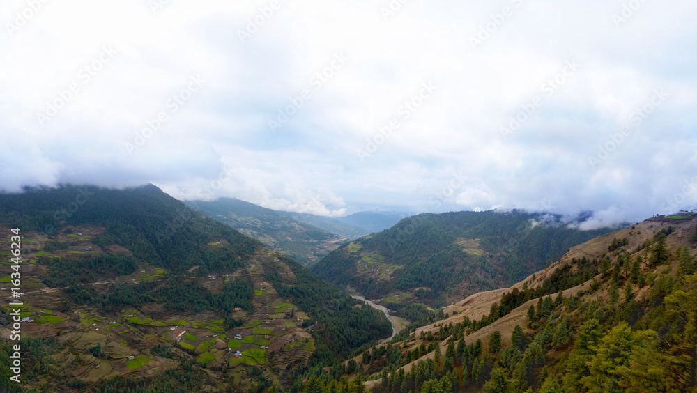 Panoramic view of the Himalayan mountains and valley via classic route to Everest Base Camp. Salleri and the Phaplu Airport, Solukhumbu district, Nepal