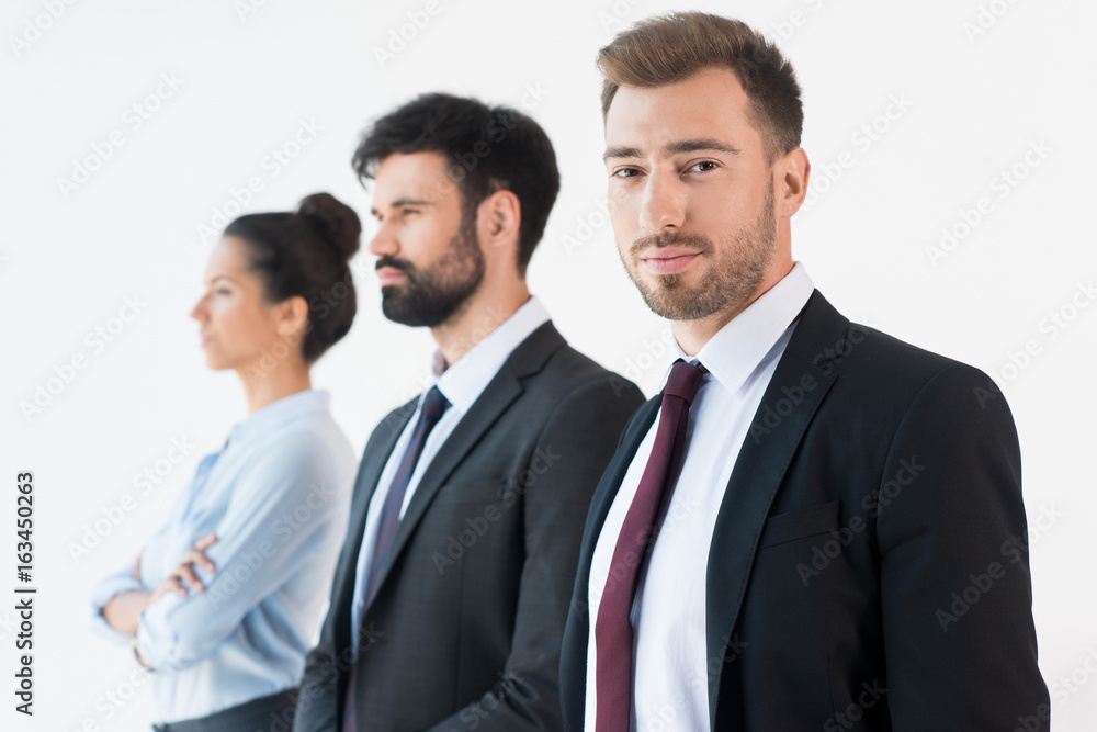 group of confident business people in formal wear isolated on white group of confident business people in formal wear isolated on white