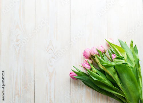 tulips on wooden surface