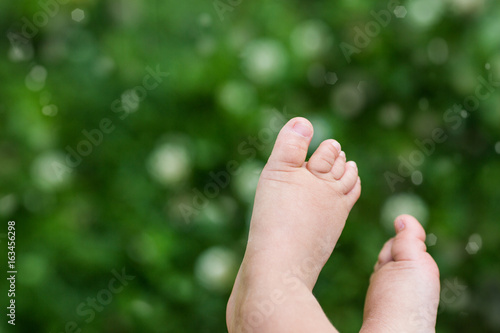 Baby's foot in nature © angiolina