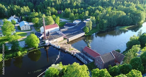 Billnas, Cinema 4k aerial view away from pinjainen steelworks, on a sunny summer evevning, in Karjaa, Uusimaa, Finland photo
