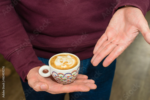 man holding pitcher. Barista prepares coffee