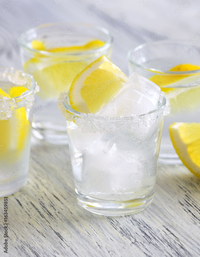 Cocktail with vodka and lemon. Vodka with ice. Cocktail with vodka and lemon. Vodka with ice.