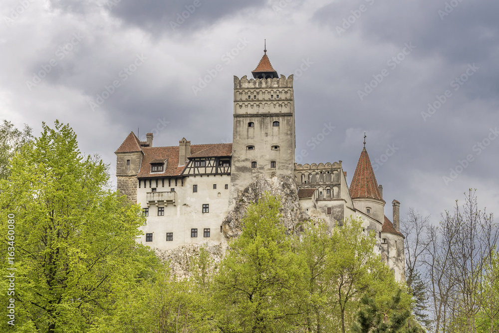 View of the famous Bran castle in Brasov district, Transylvania, Romania, against a very gloomy sky