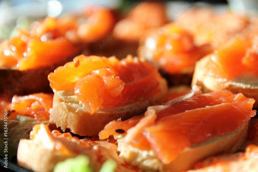 Sandwiches with pink salmon on a plate Sandwiches with pink salmon on a plate