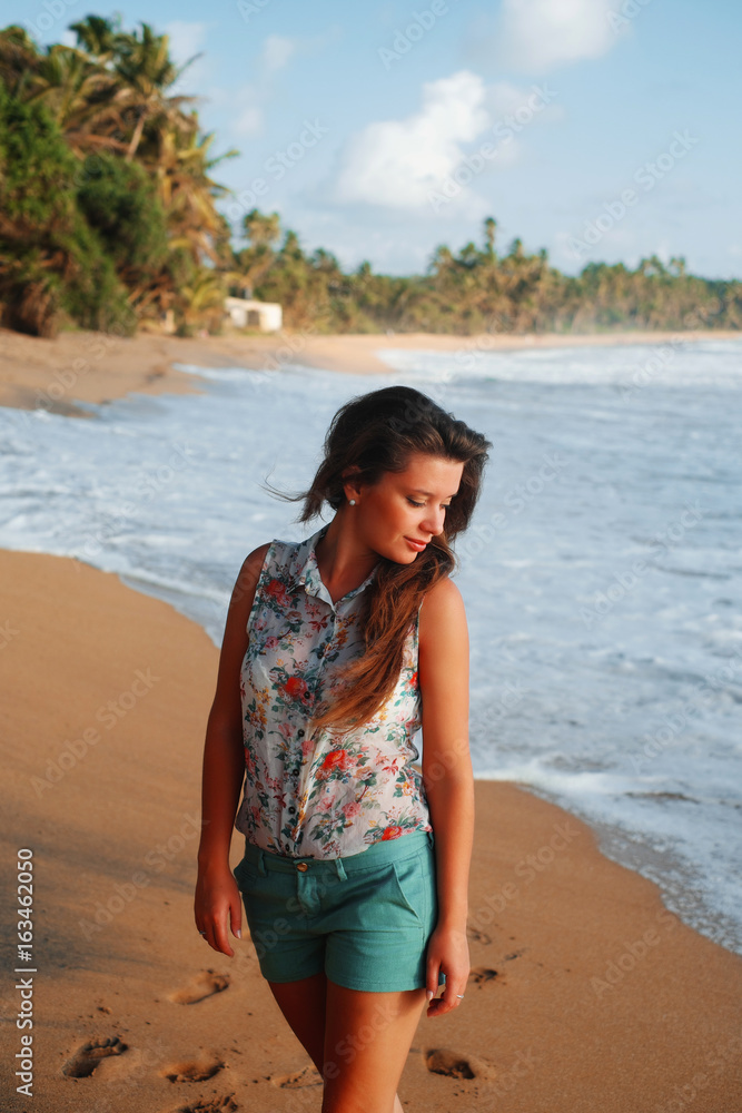 Girl on the beach near the ocean Girl on the beach near the ocean