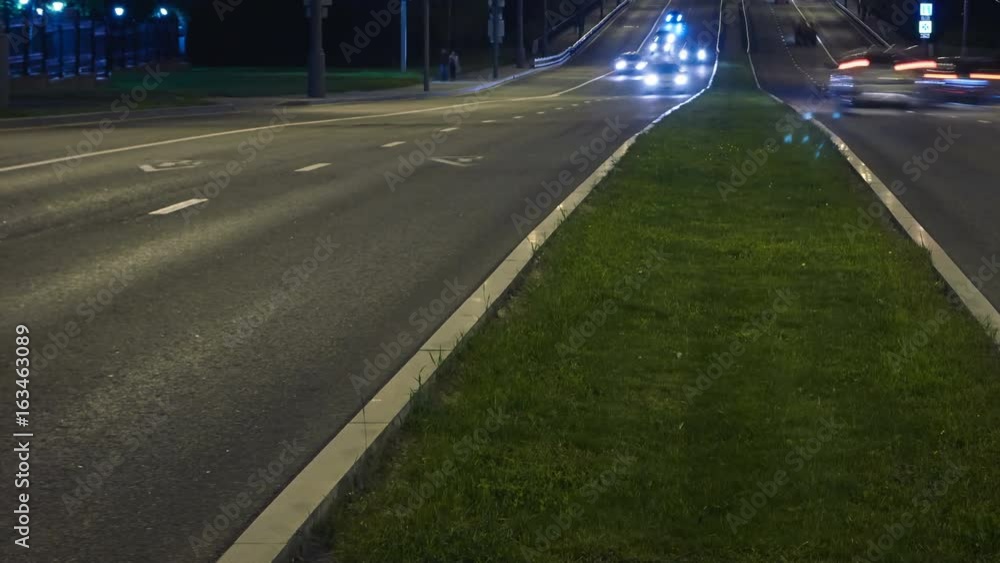 Timelapse video of automobile traffic on a city street in the night Timelapse video of automobile traffic on a city street in the night