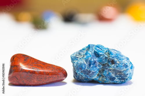 Precious stones - polished red jasper & blue Apatite crystal (on white)