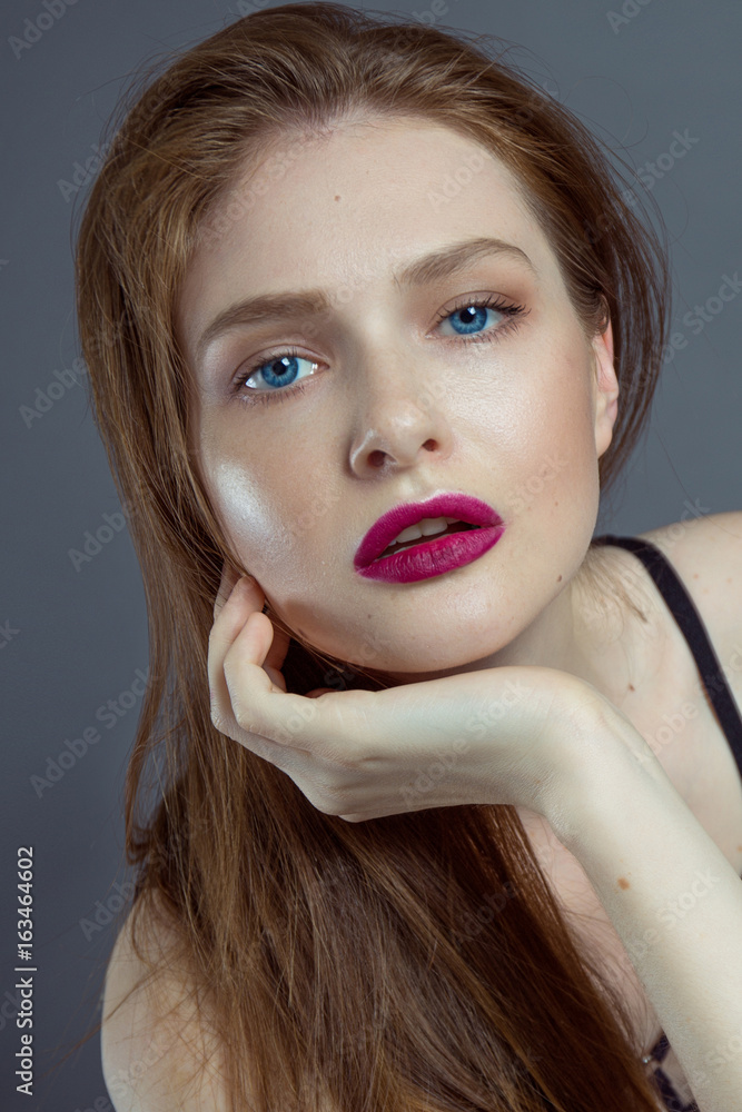 Sexy young girl with blue eyes and a slightly open mouth staring. Stock  Photo | Adobe Stock