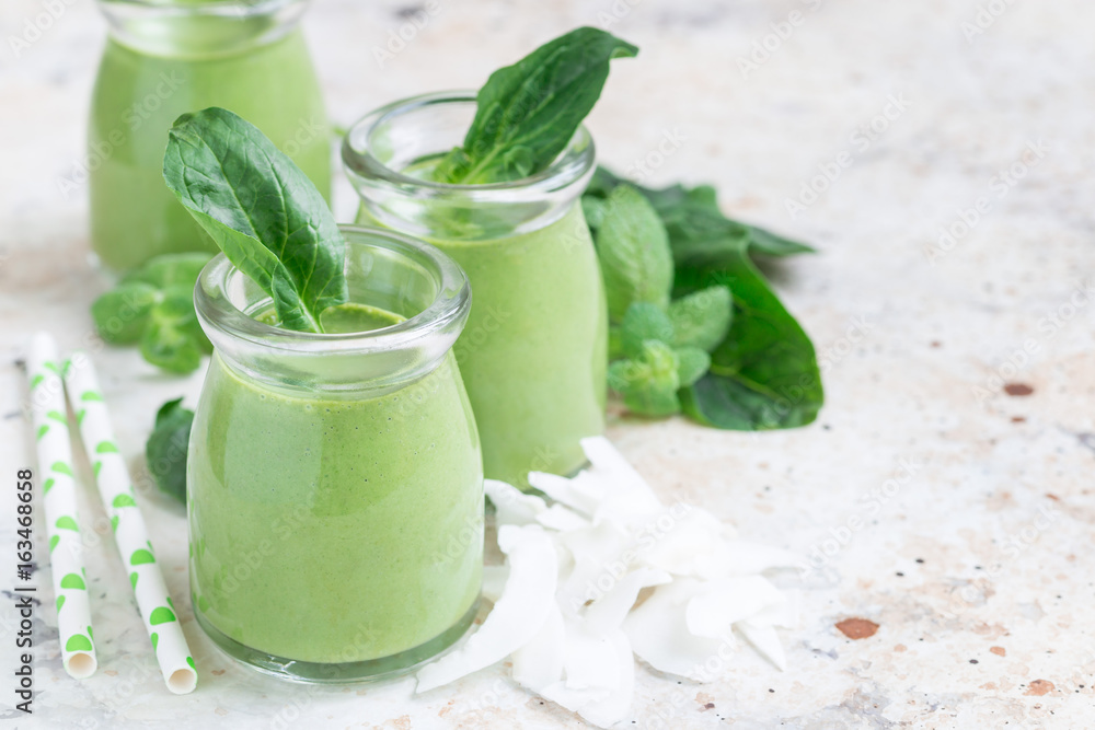 Vanilla, mint, spinach and coconut milk detox green smoothie, horizontal, copy space Vanilla, mint, spinach and coconut milk detox green smoothie, horizontal, copy space