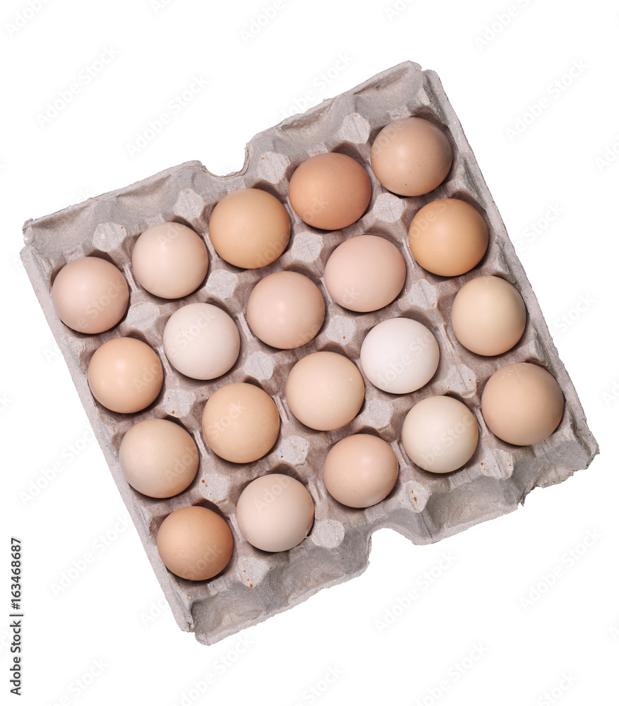 Brown eggs in an egg box, high angle view.