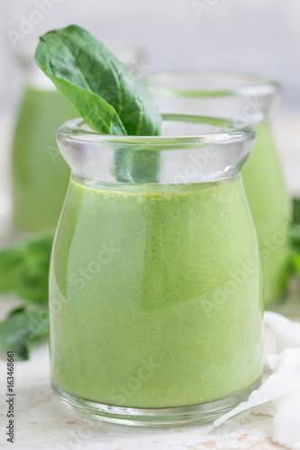 Vanilla, mint, spinach and coconut milk detox green smoothie, vertical