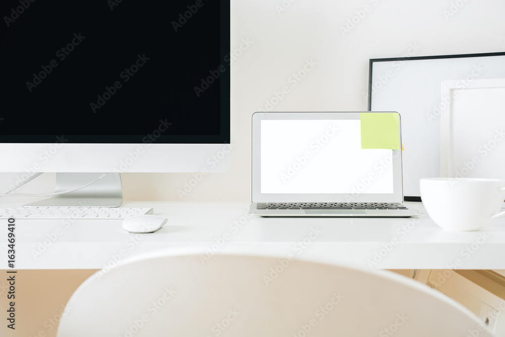 Designer desktop with computer and laptop closeup Designer desktop with computer and laptop closeup