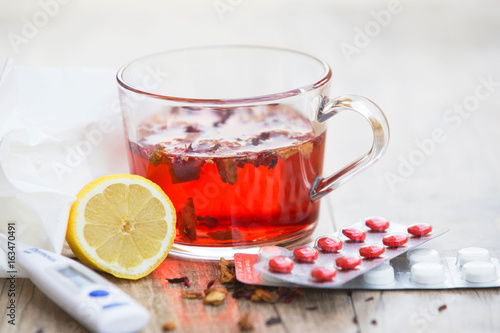 Cold treatment, hot tea and pills 