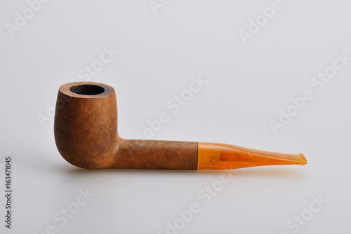 Wooden Smoking pipe on a linen beige background