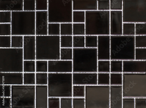 Texture of a black mosaic tile
