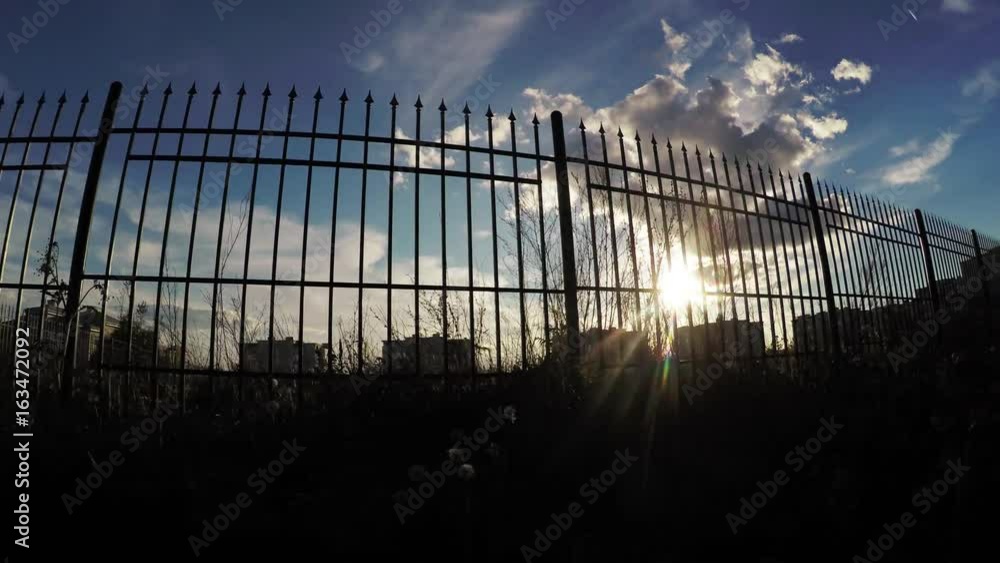 Sun through the fence Sun through the fence