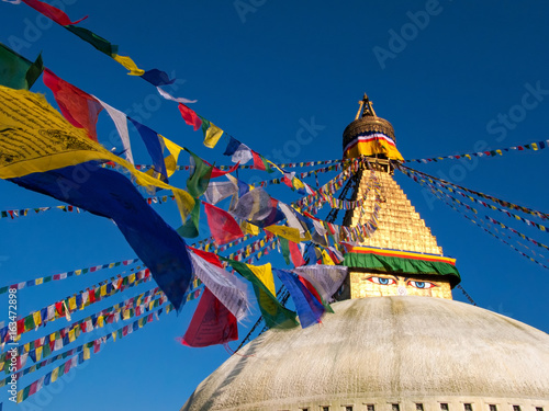 Kathmandu, Nepal: Boudhanath, a huge Buddhist stupa with blue eyes and a sacred prayer flags.