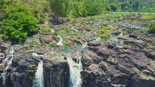 Flycam Shows Rocky Rapids Waterfalls Pongour against Plants photo