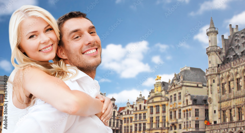 happy couple over grand place in brussels