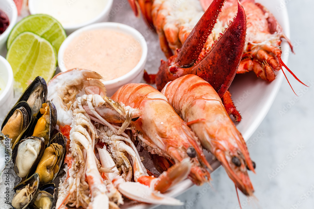 Fresh seafood platter with lobster, mussels and oysters Fresh seafood platter with lobster, mussels and oysters