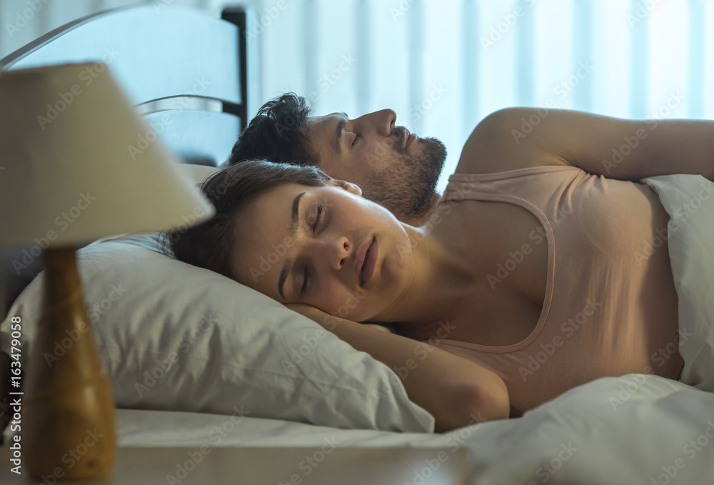 The young couple sleeping in the bed. full grip focus The young couple sleeping in the bed. full grip focus