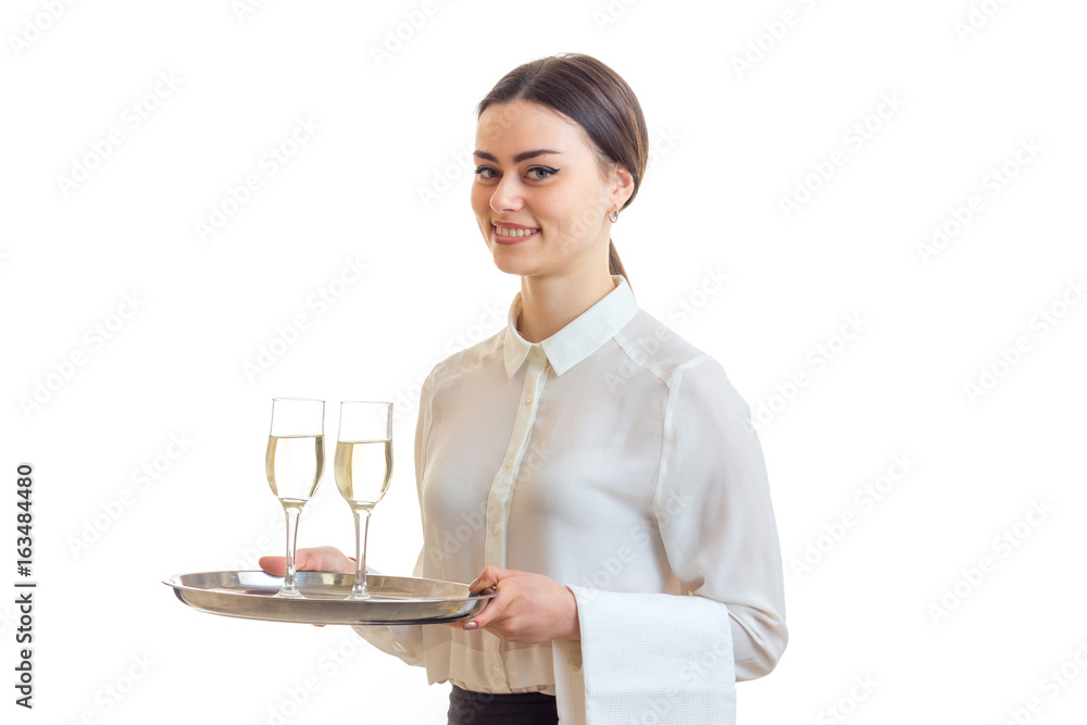 charming waitress in a white shirt smiling and holding two glasses of wine on a tray that charming waitress in a white shirt smiling and holding two glasses of wine on a tray that