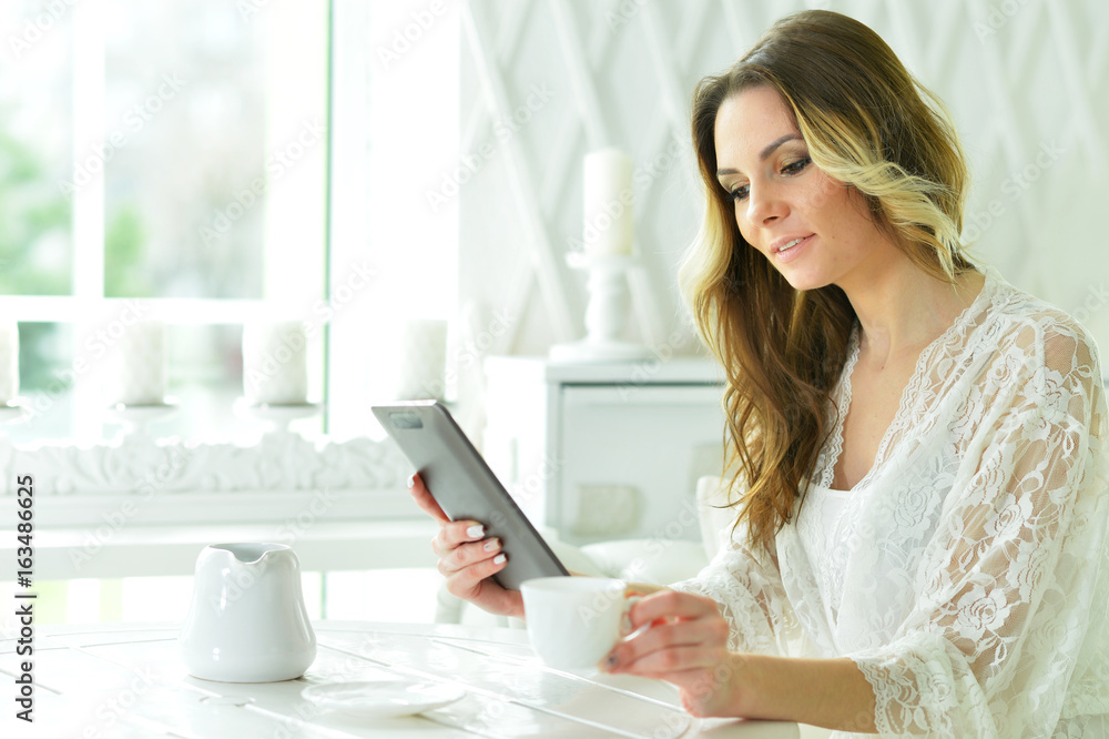 Beautiful woman with tablet in hands Beautiful woman with tablet in hands
